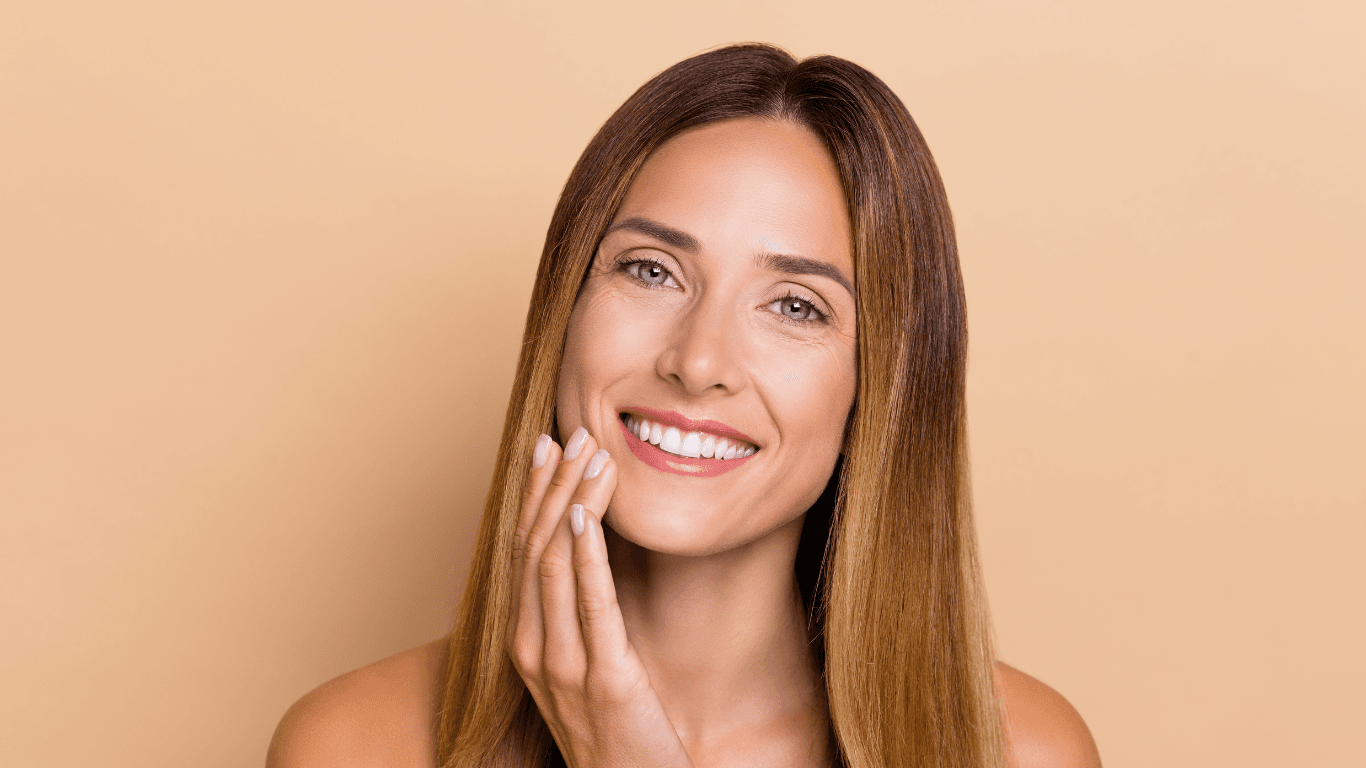 Smiling woman with smooth, shiny straight hair – representing professional deep conditioning treatment at Cruz Hairworks in Whitley Bay.