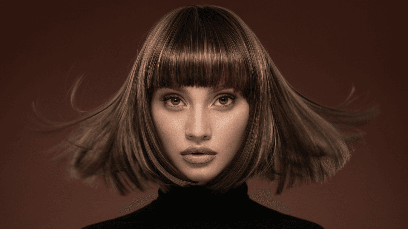 Striking model with a sleek brunette bob and fringe – banner image for Cruz Hairworks Meet the Team page in Whitley Bay.