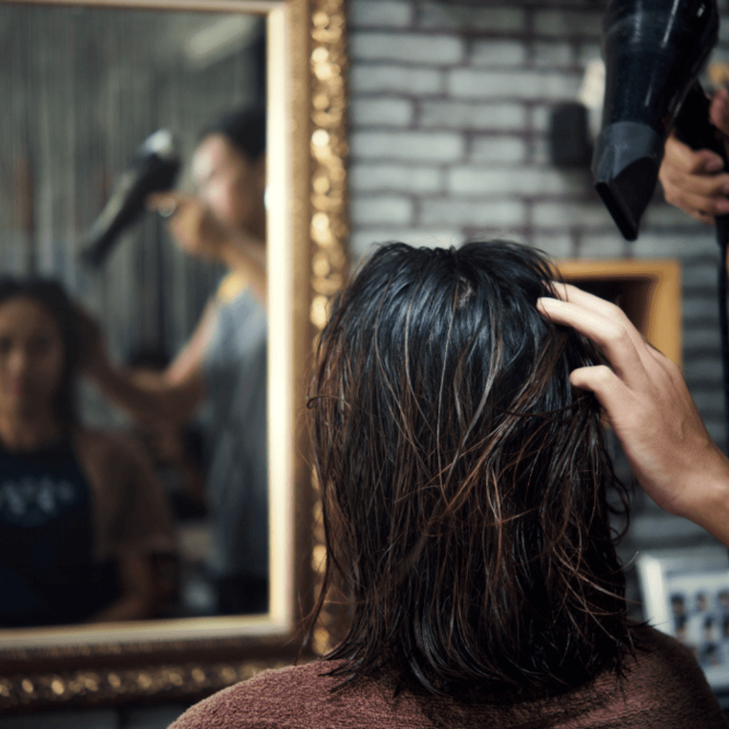 Client with freshly styled hair after a professional cut – highlighting expert cutting and styling services at Cruz Hairworks in Whitley Bay.